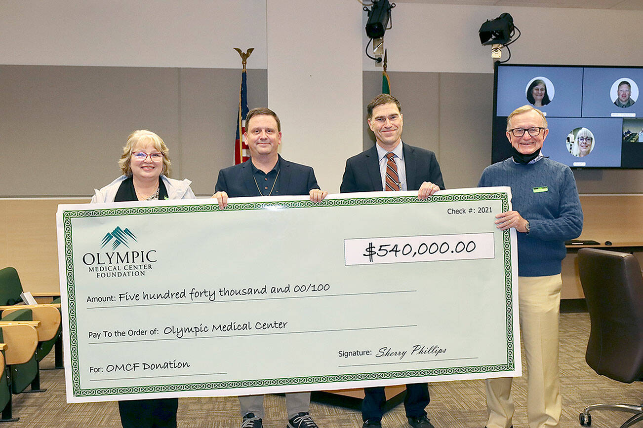 Dave Logan
Holding a giant check of the $540,000 donation from the Olympic Medical Center Foundation to the hospital are, from left, OMC Executive Committee member Karen Rogers, OMC Commissioner Chair John Nutter, OMC CEO Darryl Wolfe, and Bruce Skinner, executive director of the foundation.