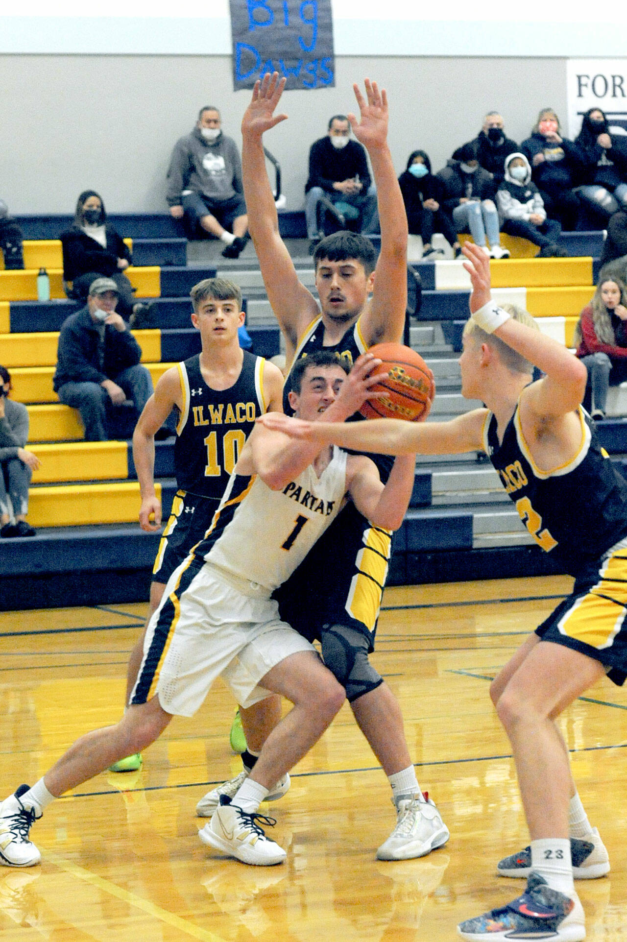 Forks’ Riley Pursley (1), along with his Spartans teammates ran into Ilwaco’s tough defense in a 58-38 loss to the Fishermen at home Wednesday. Pursley had 19 points in his season debut. (Lonnie Archibald/for Peninsula Daily News)