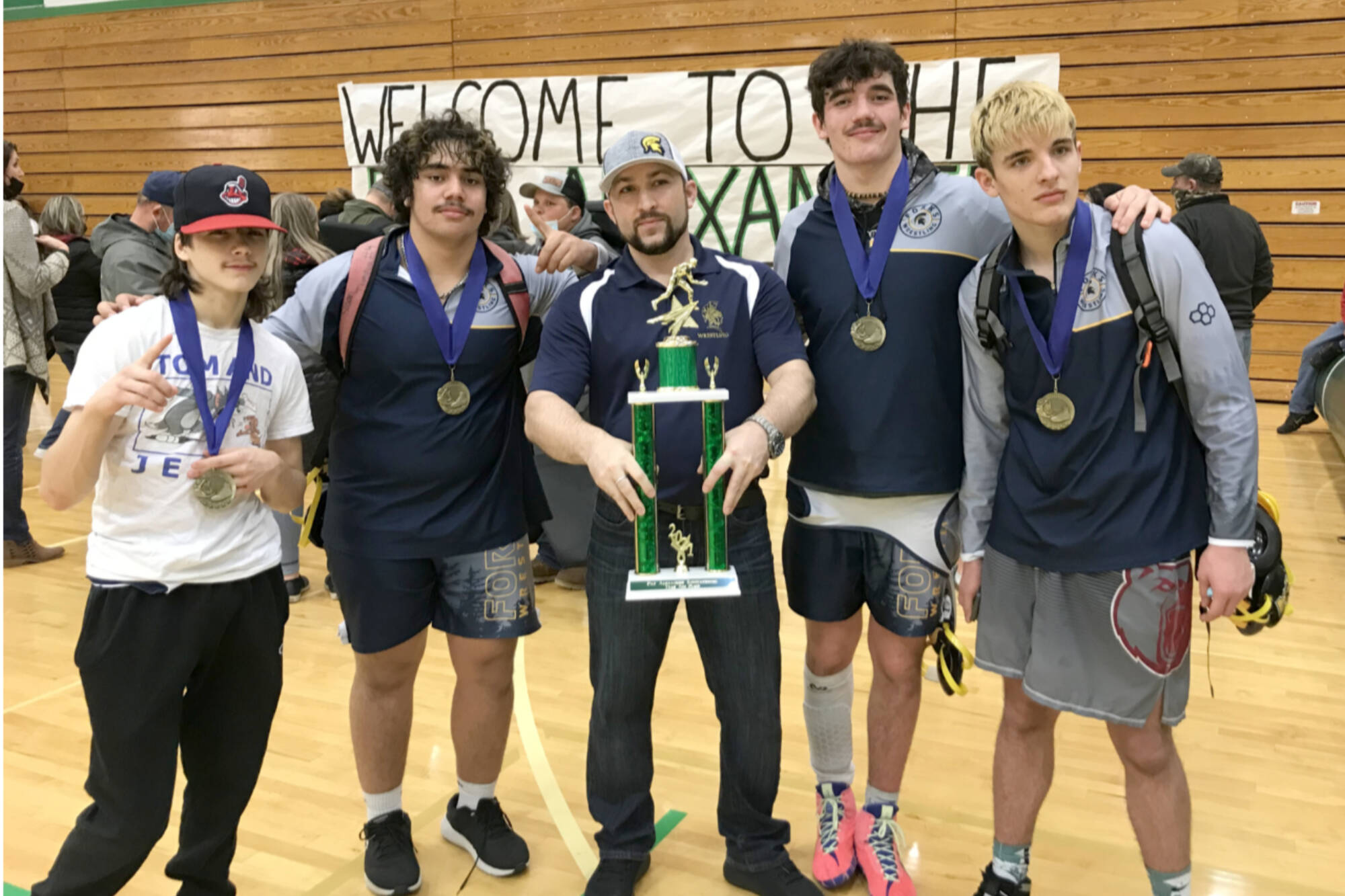 Courtesy of Forks wrestling team
Forks individual champions Saturday at the Pat Alexander Tournament in Tumwater include from left, Matthew Montes (106 pounds), Sloan Tumaua (220 pounds), Asst. Coach Daniel Frishkorn, Hayden Queen (182 pounds) and Jake Weakley (160 pounds).