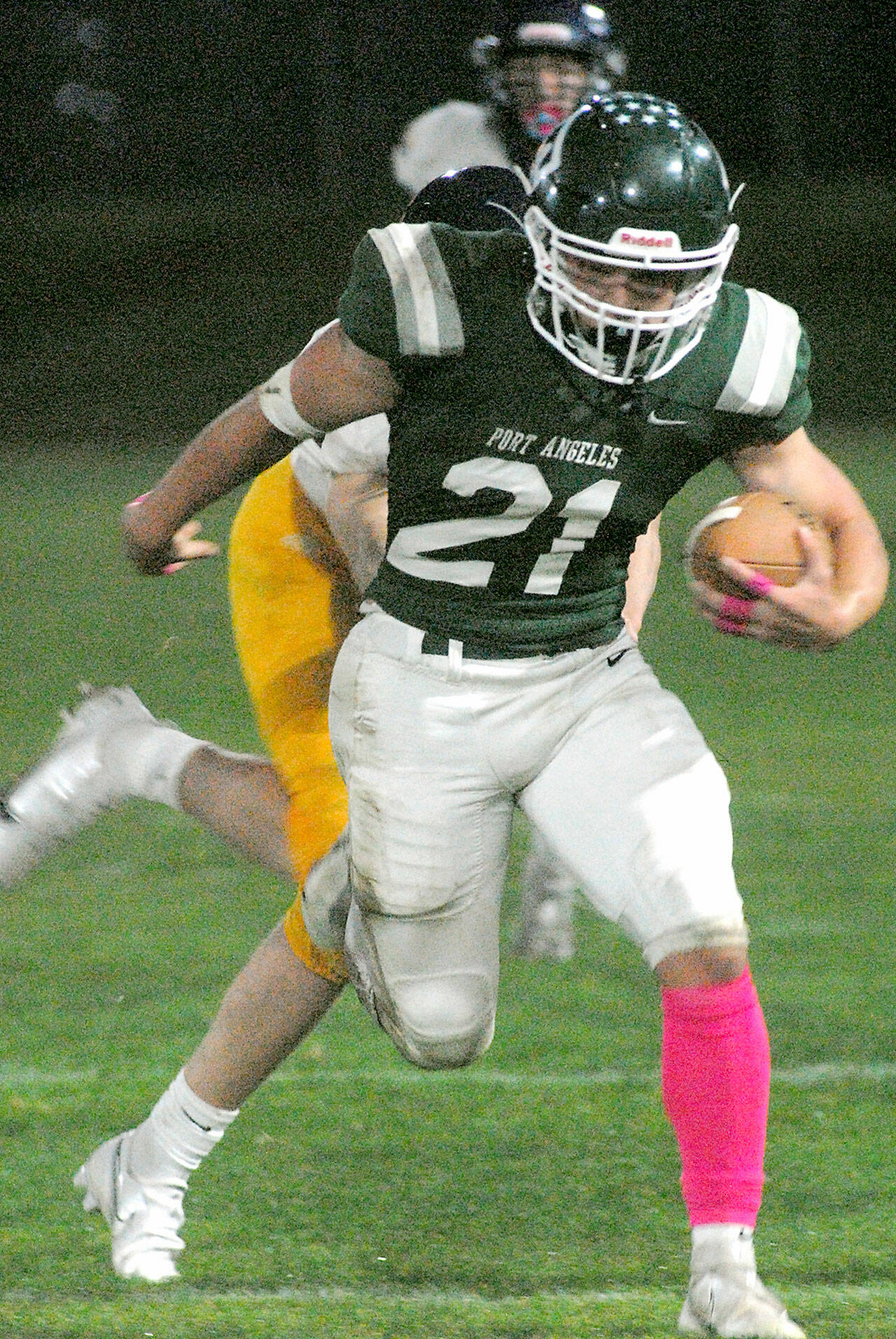 Port Angeles’ Daniel Cable escapes the Bainbridge defense in the Riders’ 27-7 win at Civic Field in October. (Keith Thorpe/Peninsula Daily News)