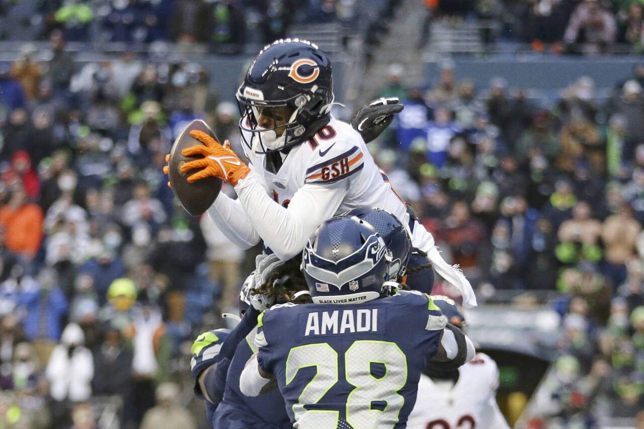 Chicago Bears wide receiver Damiere Byrd (10) grabs a 2-point conversion pass in the end zone to score over Seattle Seahawks' Ugo Amadi during the second half of an NFL football game, Sunday, Dec. 26, 2021, in Seattle. The Bears won 25-24. (AP Photo/Lindsey Wasson)