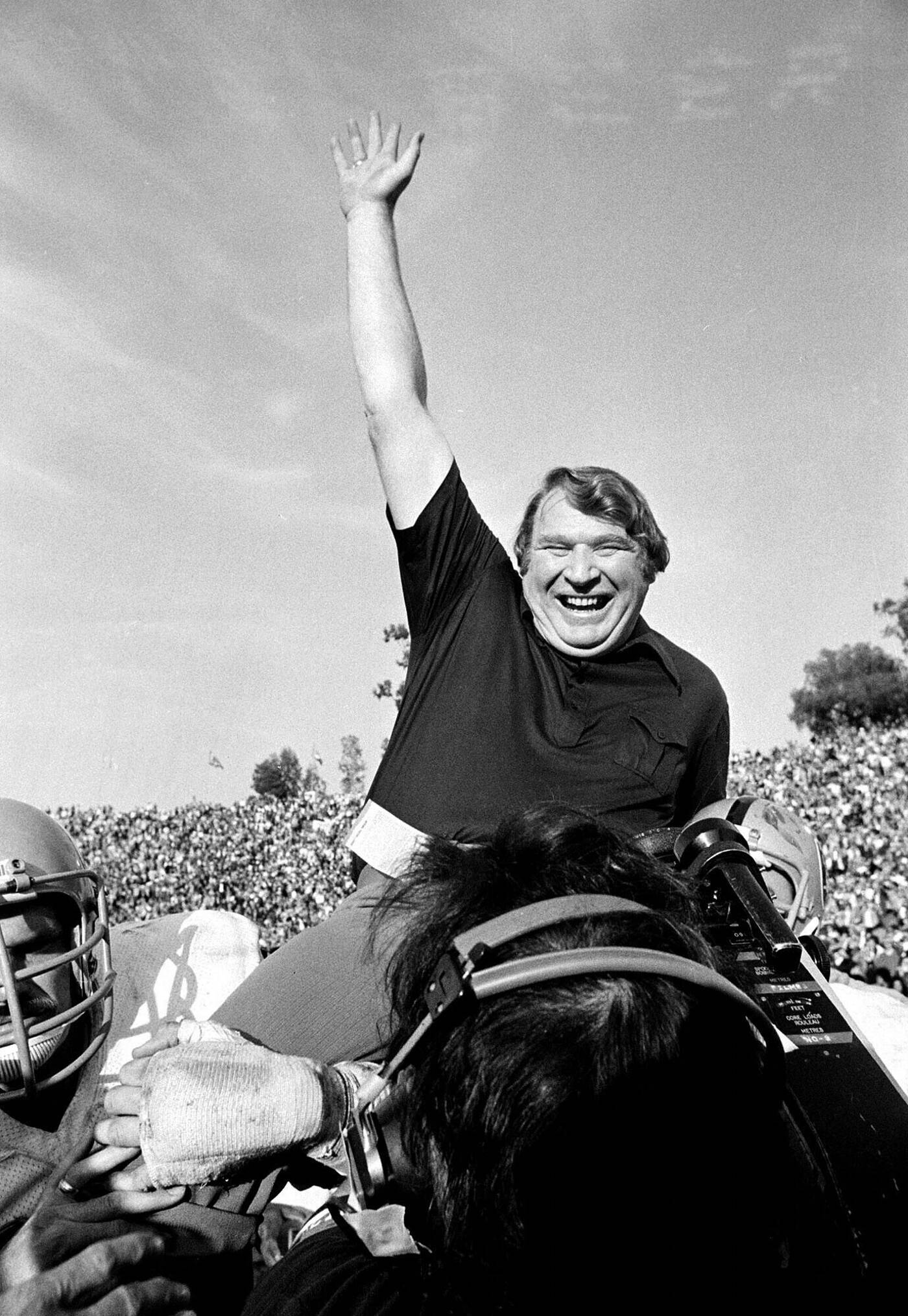 Coach John Madden of the Oakland Raiders is carried from the field by his players after his team defeated the Minnesota Vikings in Super Bowl XI in Pasadena, Calif., Jan. 9, 1977 John Madden, the Hall of Fame coach turned broadcaster whose exuberant calls combined with simple explanations provided a weekly soundtrack to NFL games for three decades, died Tuesday, the NFL announced. He was 85. (AP Photo/File)