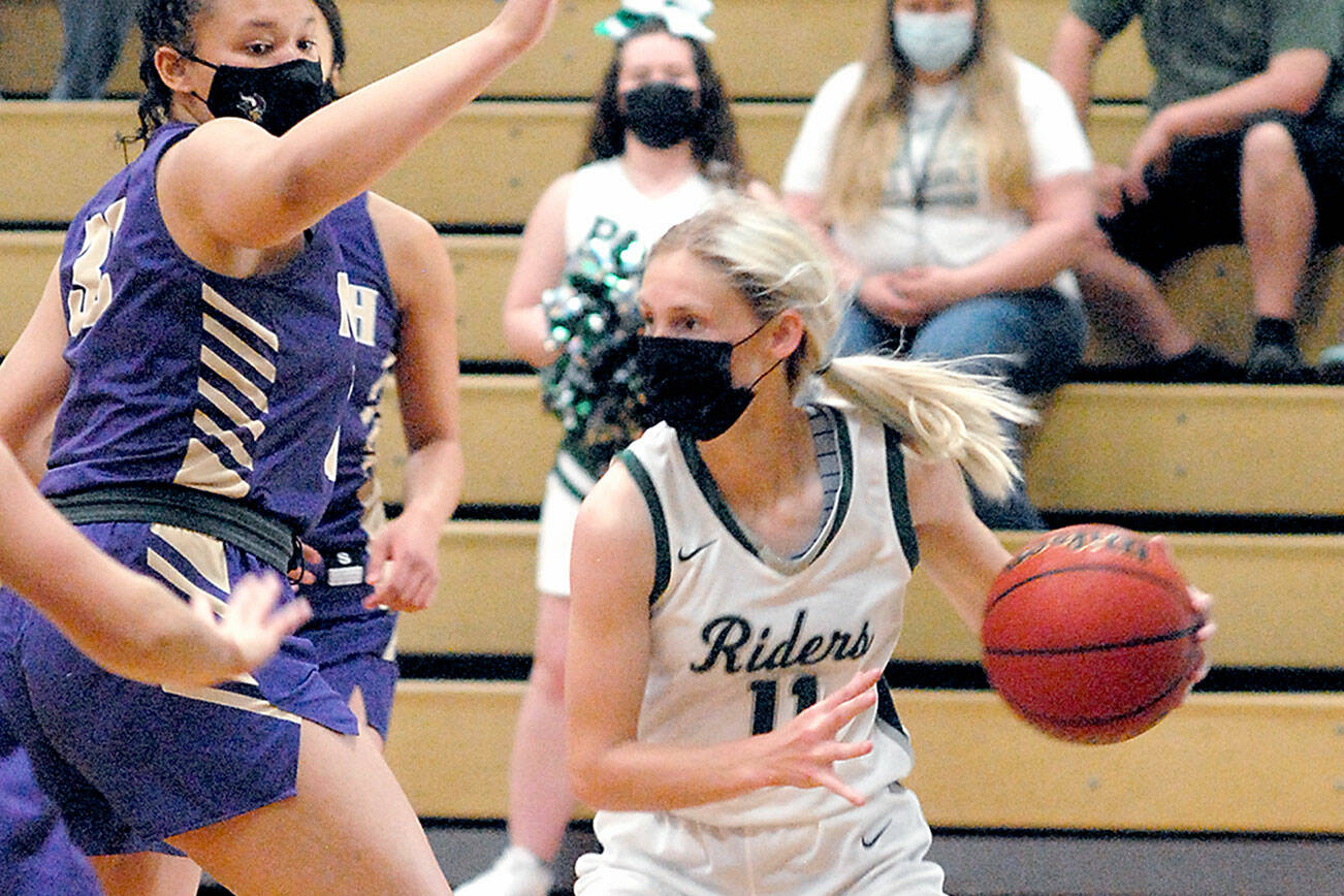Keith Thorpe/Peninsula Daily News
Port Angeles' Millie Long, right, looks to pass during a game with North Kitsap. Long, the Olympic League girls soccer and basketball MVP and a standout for Peninsula College, is the Peninsula Daily News Athlete of the Year.