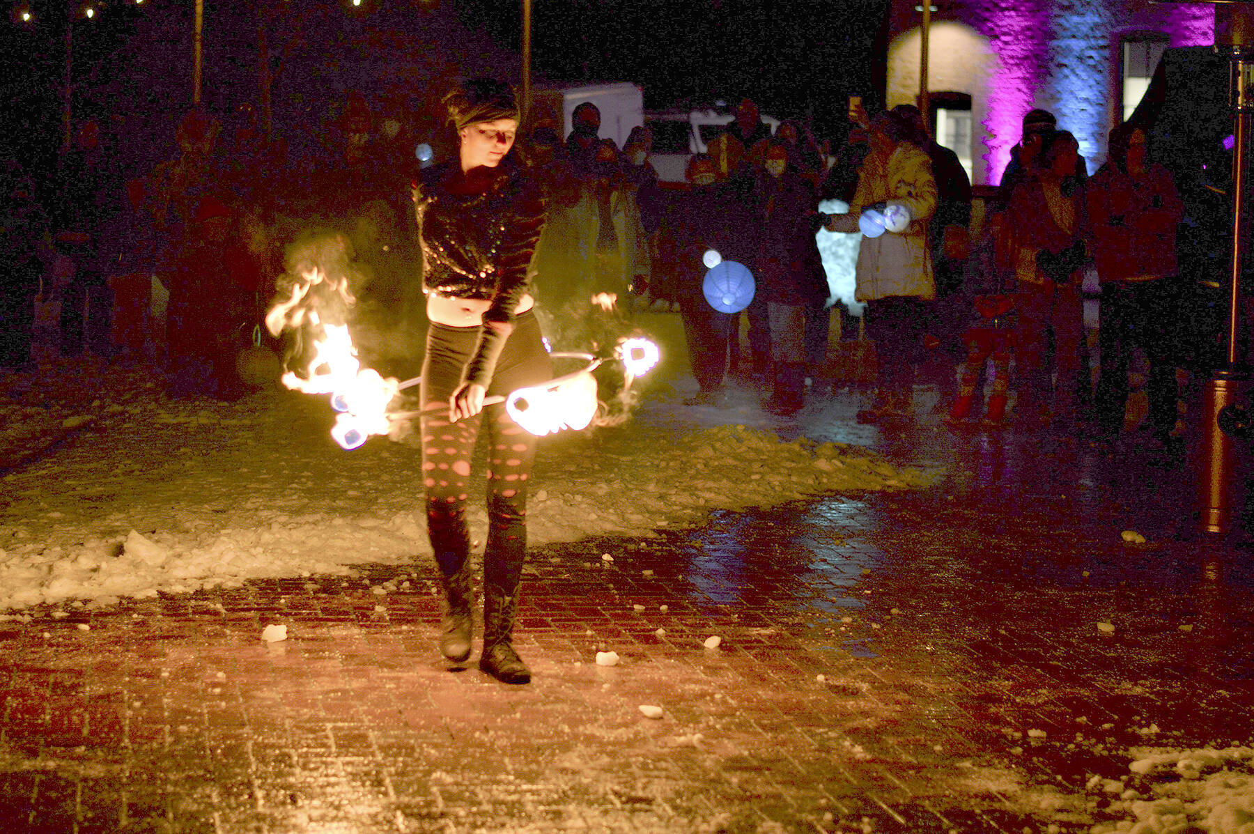 Alex Eisenberg of Port Townsend did some fire dancing during the First Night festivities Friday at downtown's Pope Marine Park. He's part of an ensemble that includes Ashley Kehl of Port Townsend and Cristy Christensen of Bellingham.  Diane Urbani de la Paz/Peninsula Daily News