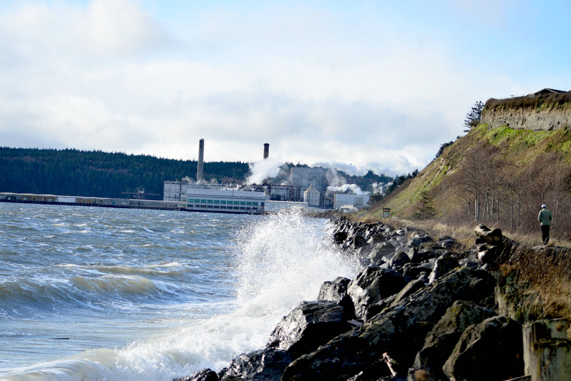 A lone pedestrian walks the Larry Scott Trail toward the Port Townsend Paper Mill on Monday morning as a stiff wind whips up the waves nearby. (Diane Urbani de la Paz/Peninsula Daily News)