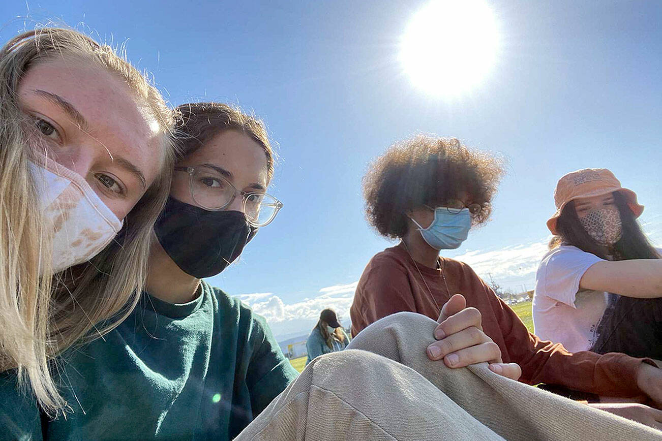 “Spring Reunion” by Celeste Tucker is one of 39 photographs in “The World on Pause,” the exhibition open now at the Port Angeles Fine Arts Center. From left are Port Angeles high schoolers Gillian Wolfe, 17, Olivia Carroll, 17, Bella Artis, 16, and Celeste Tucker, 17. (Celeste Tucker)