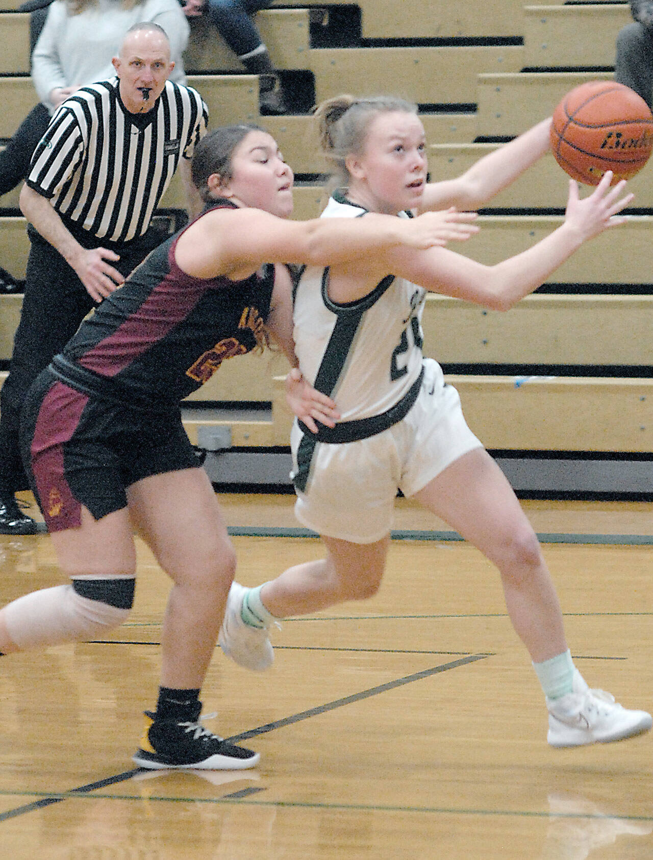 Keith Thorpe/Peninsula Daily News Port Angeles’ Anna Petty, right, evades the defense of Kingston’s Jayla Moon on Thursday in Port Angeles.