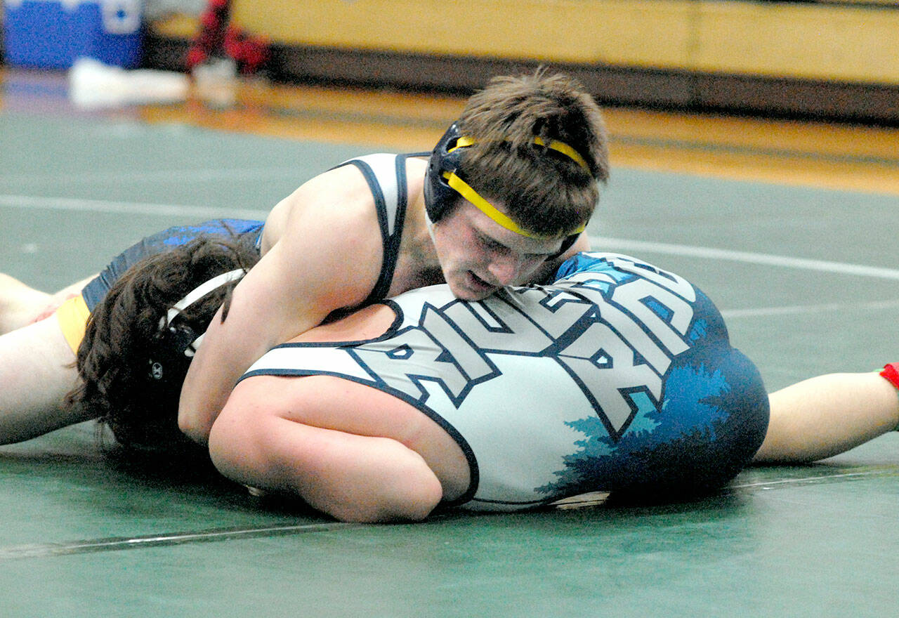 Kaleb Blanton of Forks, top, takes on River Ridges Collin Andrews in the 152-pound class on Saturday in Port Angeles. (Keith Thorpe/Peninsula Daily News)