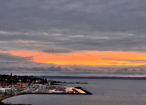 After days of dreary cold and rainy weather, Port Townsend is enveloped in a rosy glow of a sunrise. (Steve Mullensky/for Peninsula Daily News)