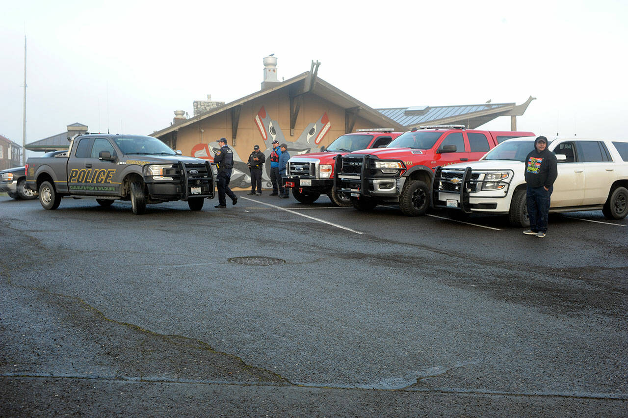 LaPush law enforcement along with Clallam County Fire District 1 rescue and emergency teams await on a hill at the Quileute Senior Center above the Quileute School watching for the expected tsunami to hit the LaPush beaches. (Lonnie Archibald/for Peninsula Daily News)