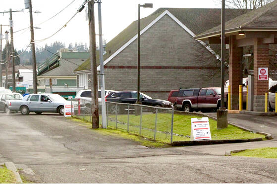 One place where COVID-19 testing is available in Port Angeles is the Olympic Medical Center drive-up testing facility at the former Wells Fargo Bank at Front and Race streets. Intake forms must be filed out before testing is done. The form can be found at www.olympicmedical.org/services/covid-19-services. (Dave Logan/for Peninsula Daily News)