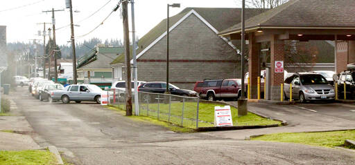 One place where COVID-19 testing is available in Port Angeles is the Olympic Medical Center drive-up testing facility at the former Wells Fargo Bank at Front and Race streets. Intake forms must be filed out before testing is done. The form can be found at www.olympicmedical.org/services/covid-19-services. (Dave Logan/for Peninsula Daily News)