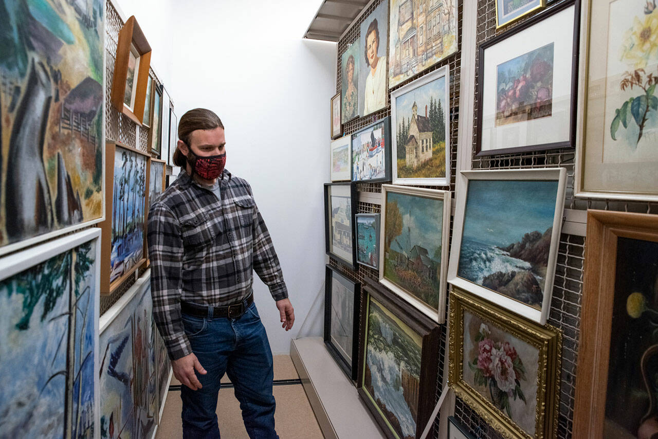 At the North Olympic History Center in Port Angeles, many decades of paintings by local artists are stored in a climate-controlled building, which was the former Lincoln School’s gymnasium. (Emily Matthiessen/Olympic Peninsula News Group)