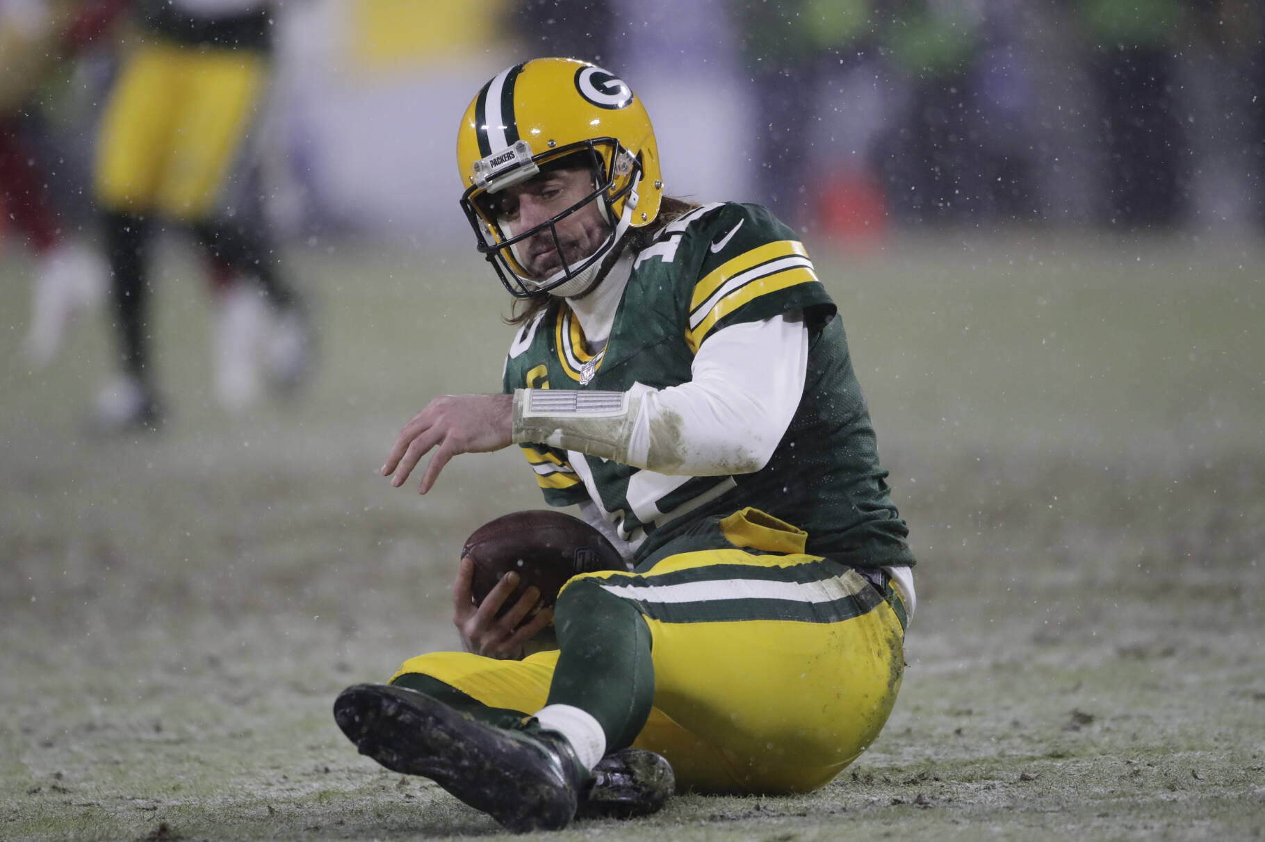 Green Bay Packers’ Aaron Rodgers reacts after being sacked by San Francisco 49ers’ Arik Armstead during the second half of an NFC divisional playoff NFL football game Saturday, Jan. 22, 2022, in Green Bay, Wis. (AP Photo/Aaron Gash)