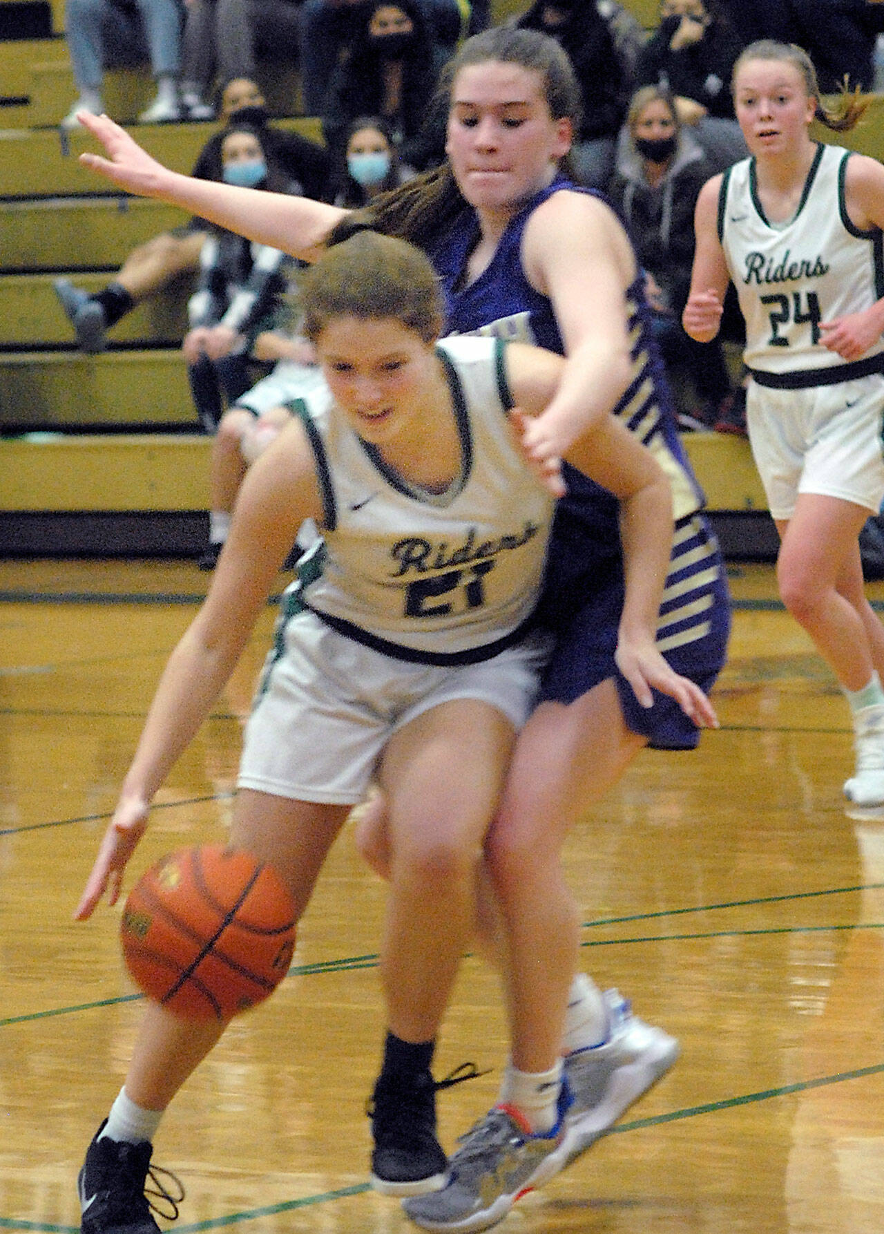 Keith Thorpe/Peninsula Daily News
Port Angeles' Jayde Gedelman, front, fends of the advances of Nort Kitsap's Sophia Baugh as Gedelman's teammate, Anna Petty, left, looks on during Thursday's game in Port Angeles.