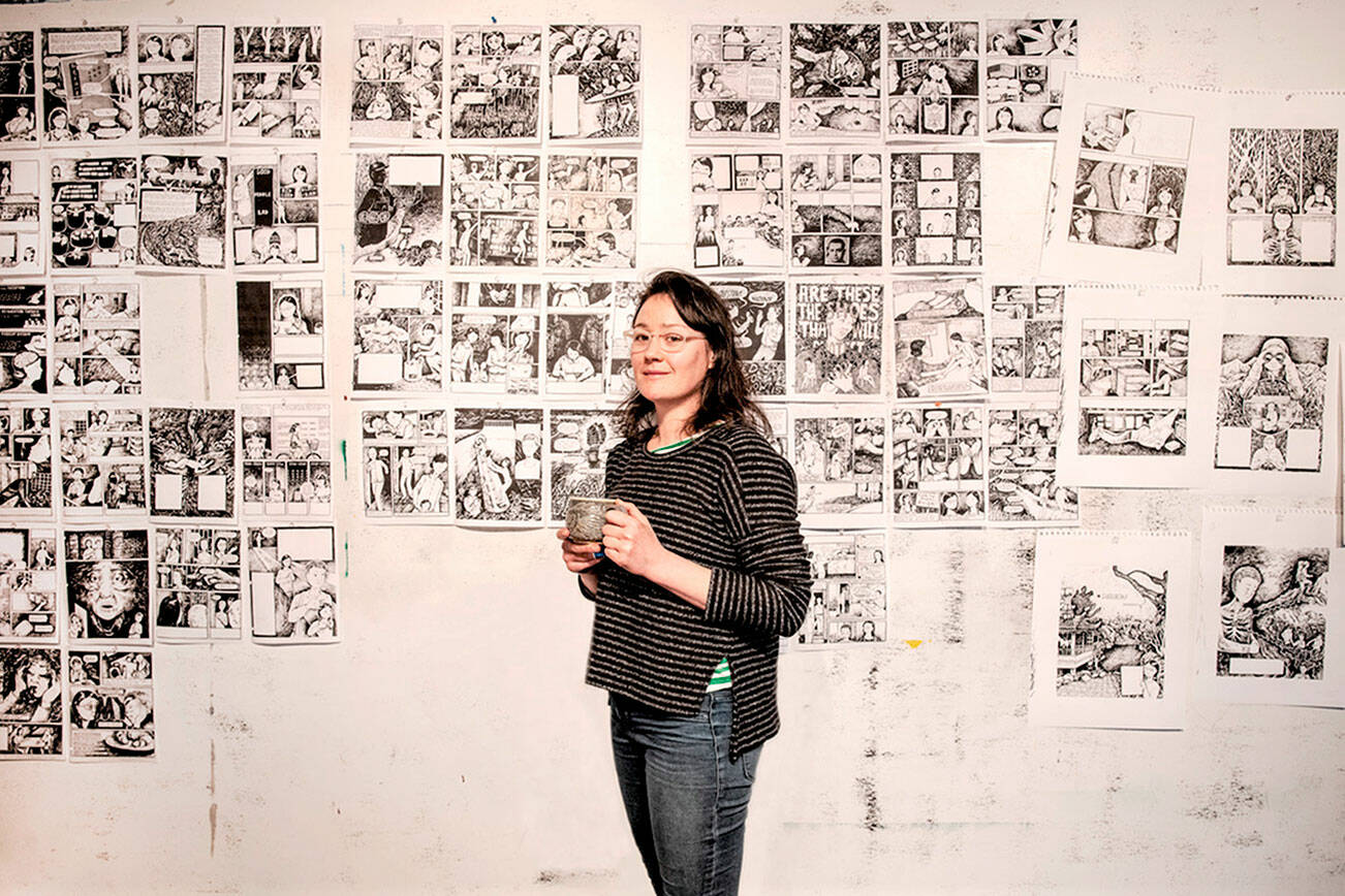 Tessa Hulls, pictured with artwork for her graphic memoir "Feeding Ghosts," is the featured artist in 2022's inaugural First Friday Speaker Series program this Friday. The Jefferson County Historical Society hosts the online talk, part of a triptych of Chinese American Voices. photo by Hall Anderson