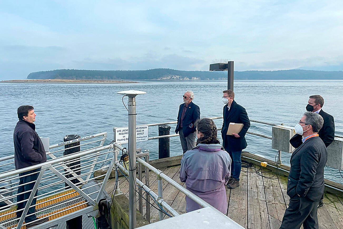 Pacific Northwest National Laboratory research scientist and dive officer John Vavrinec, left, shares details of PNNL’s work on Sequim Bay with U.S. Reps. Dan Newhouse and Derek Kilmer last week. 

Photo courtesy Pacific Northwest National Laboratory