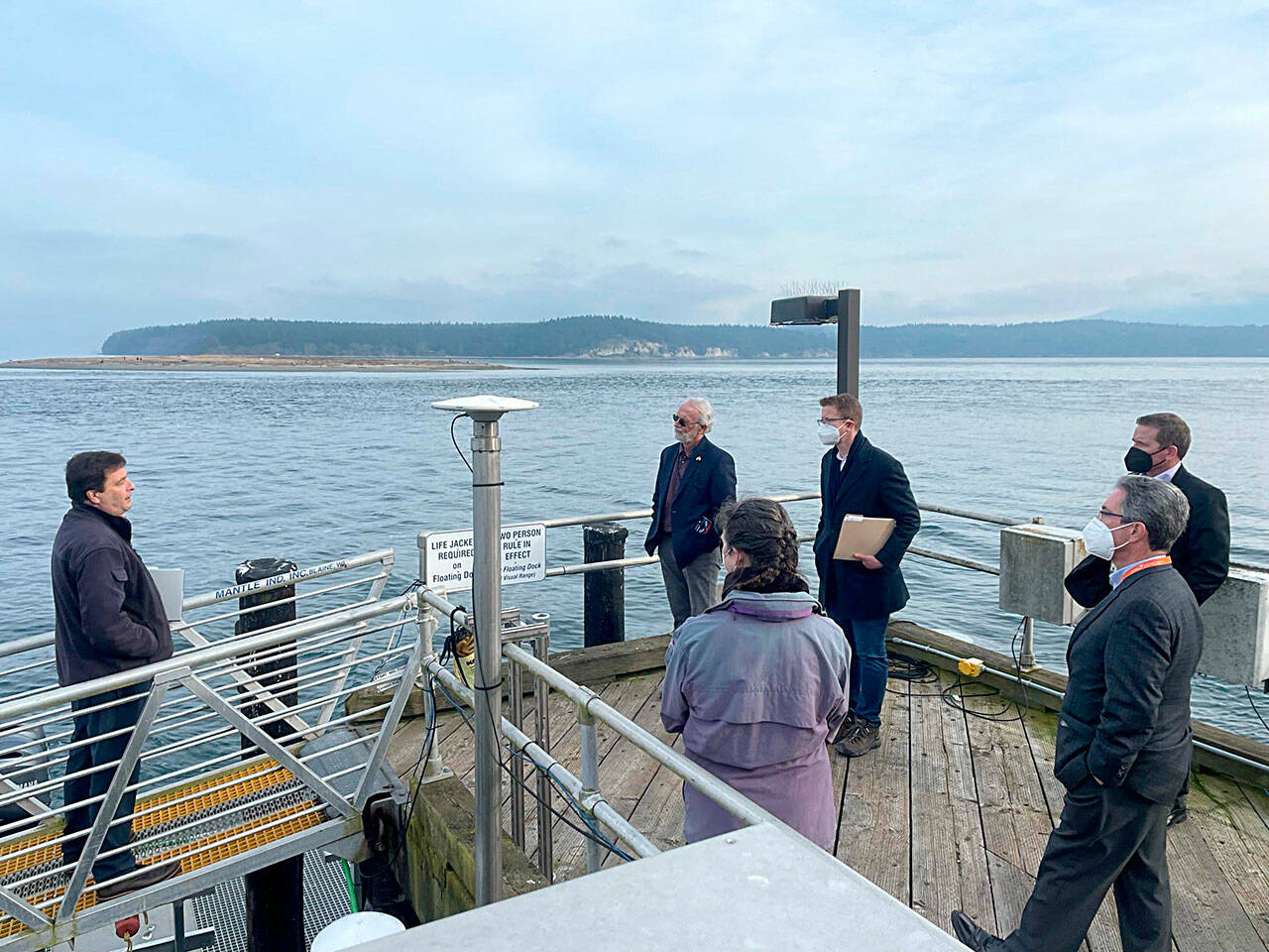 Pacific Northwest National Laboratory research scientist and dive officer John Vavrinec, left, shares details of PNNL’s work on Sequim Bay with U.S. Reps. Dan Newhouse and Derek Kilmer last week. (Photo courtesy Pacific Northwest National Laboratory)