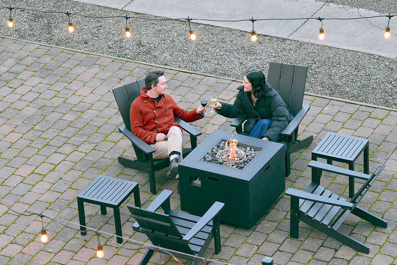 Eric Wennberg and Jessica Jennings, new owners of the Bishop Hotel in Port Townsend, have connected their garden to the indoor wine bar. Diane Urbani de la Paz/Peninsula Daily News