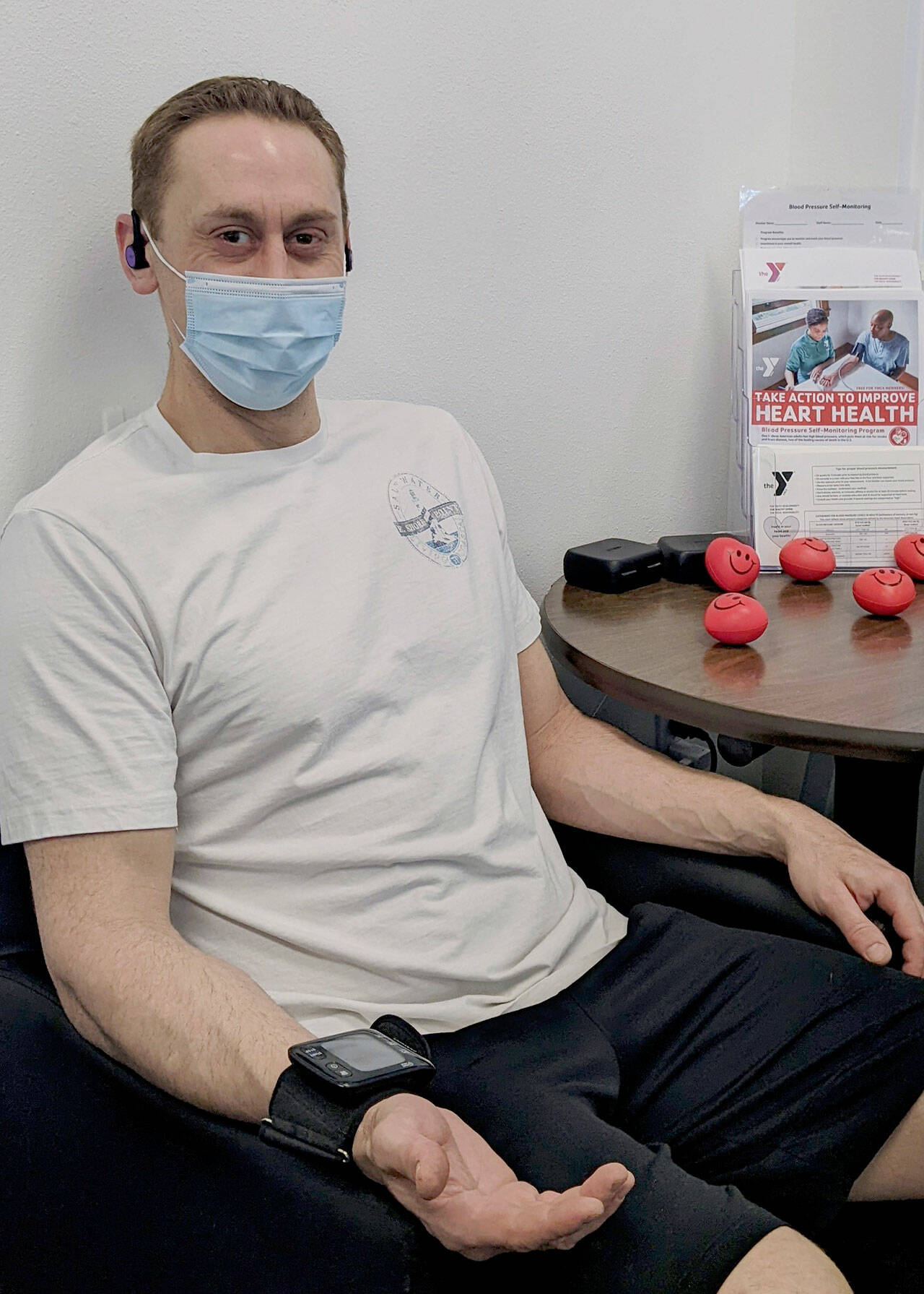 YMCA of Sequim member Nick Durso takes his blood pressure using a wrist blood pressure monitoring cuff at the YMCA of Sequim. (Photo courtesy of YMCA of Sequim)