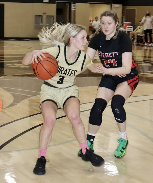 Peninsulas Millie Long, left, tries to get around Everett defender Sydney VanNess. (Dave Logan/for Peninsula Daily News)