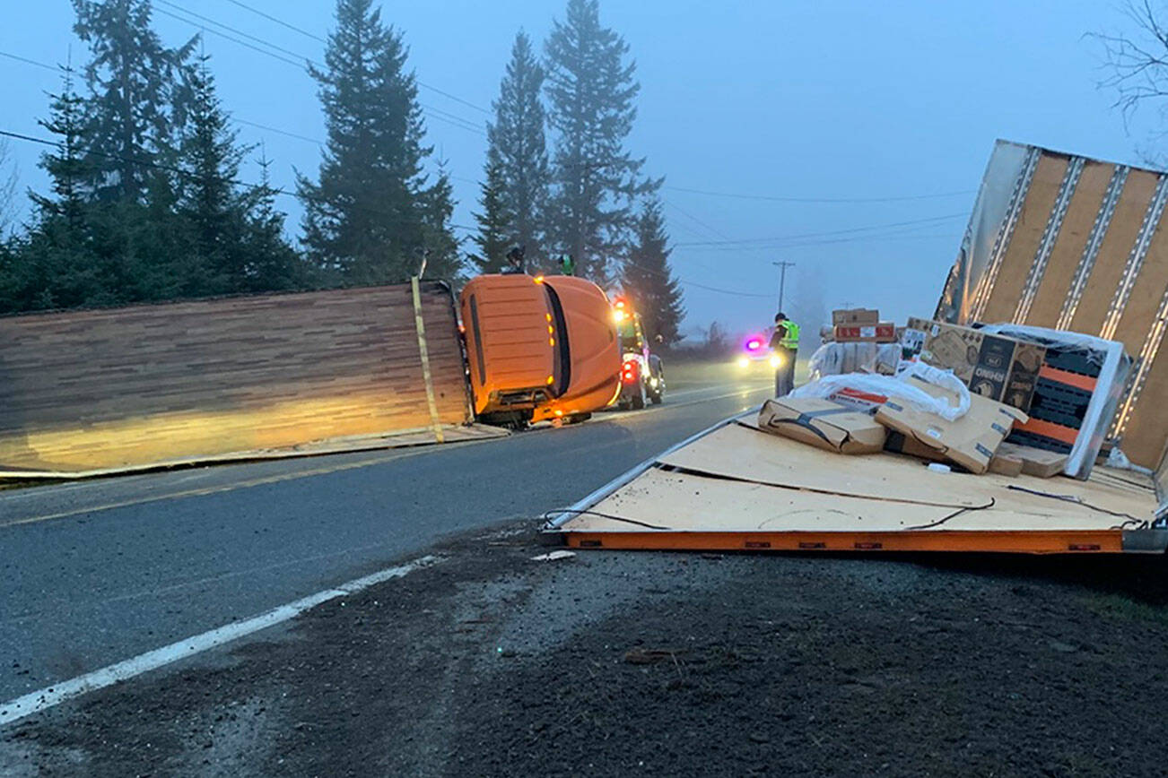 Photo courtesy of State Patrol 

A semi truck driver was transported to Olympic Medical Center with minor injuries after his truck rolled east of Sequim.