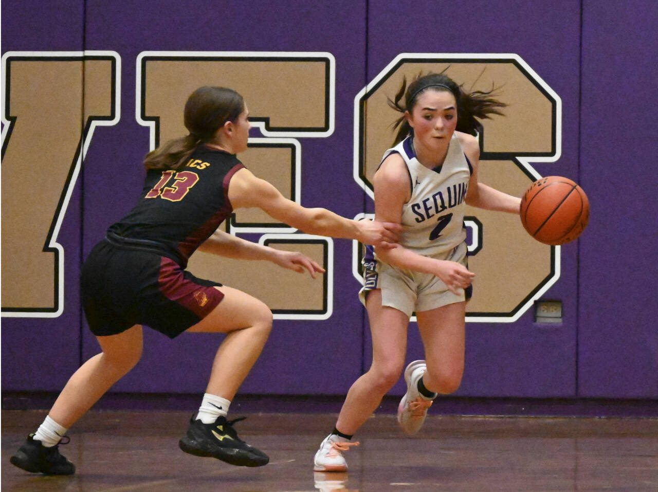 Sequim’s Hannah Bates brings the ball up the court against Kingston in Sequim on Tuesday night. Sequim won the game 45-41. (Michael Dashiell/Olympic Peninsula News Group)