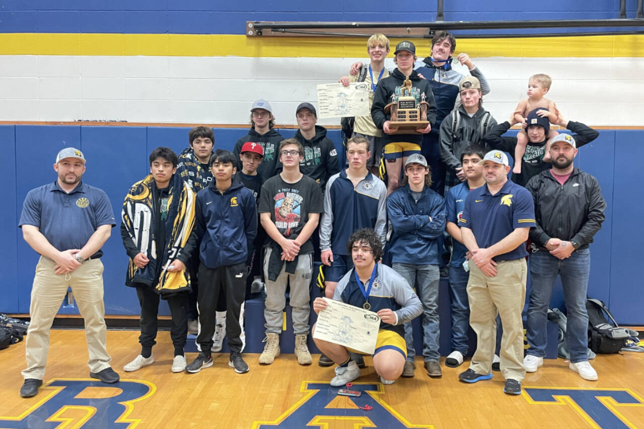 The Forks boys wrestling team celebrates winning the District 1 1B/2B Regional held in Adna this weekend. Forks had four weight division winners at regional — Jake Weakley, Hayden Queen, Sloan Tumaua and Conner Demorest.