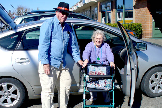 Jon Langdon of Port Townsend, ECHHO’s 2021 volunteer of the year, helps Pat Norton, one of the nonprofit agency’s clients. ECHHO seeks volunteers to drive people to their medical appointments around the region. (ECHHO)