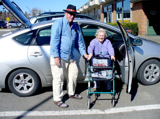 Jon Langdon of Port Townsend, ECHHO’s 2021 volunteer of the year, helps Pat Norton, one of the nonprofit agency’s clients. ECHHO seeks volunteers to drive people to their medical appointments around the region. (ECHHO)