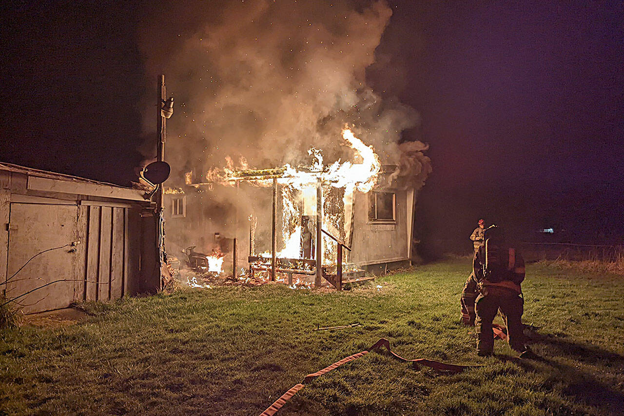 Clallam County Fire District 3 firefighters pulled a man from his home near Woodcock Road on Sunday night within 90 seconds of arriving on scene. (Photo courtesy Clallam County Fire District 3)