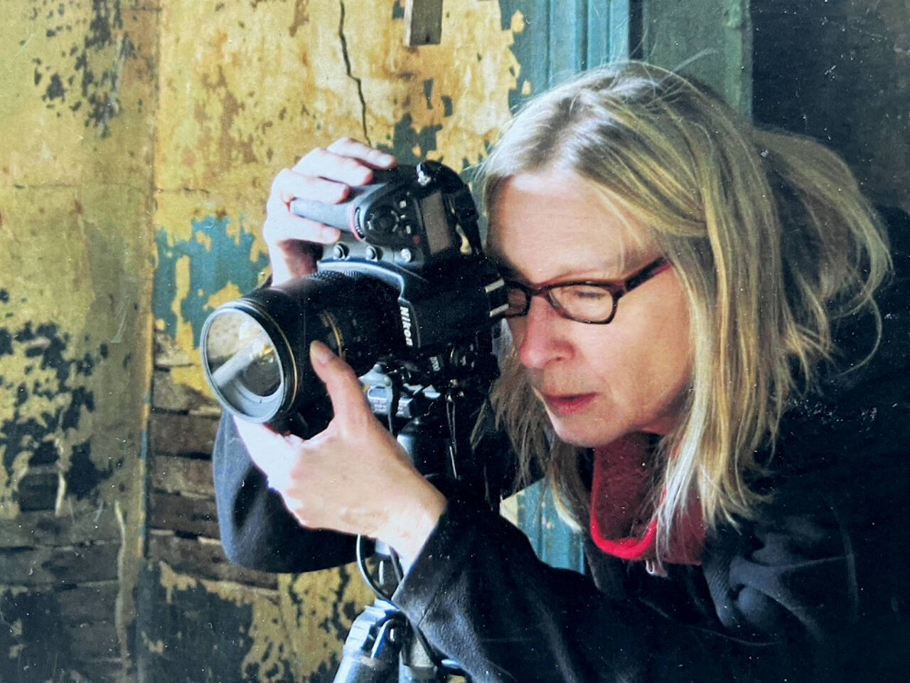 The late Karen Rozbicki Stringer, a fine art photographer is shown at work. Her photographs will be displayed In Memoriam at the Blue Whole Gallery in March.