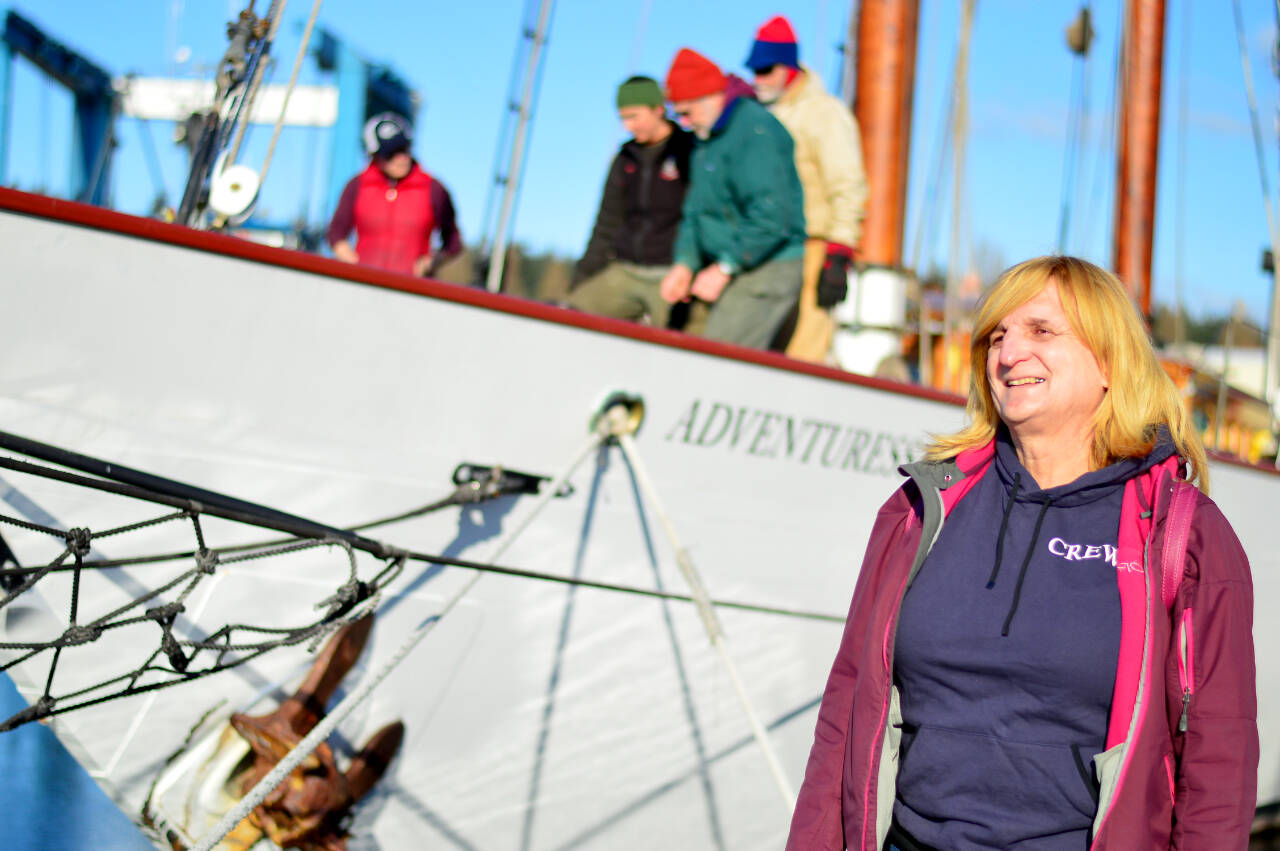 Susan Brittain, with the schooner Adventuress behind her at the Port Townsend Boat Haven, is one of six storytellers in "She Tells Sea Tales," an online event this Saturday. Diane Urbani de la Paz/Peninsula Daily News