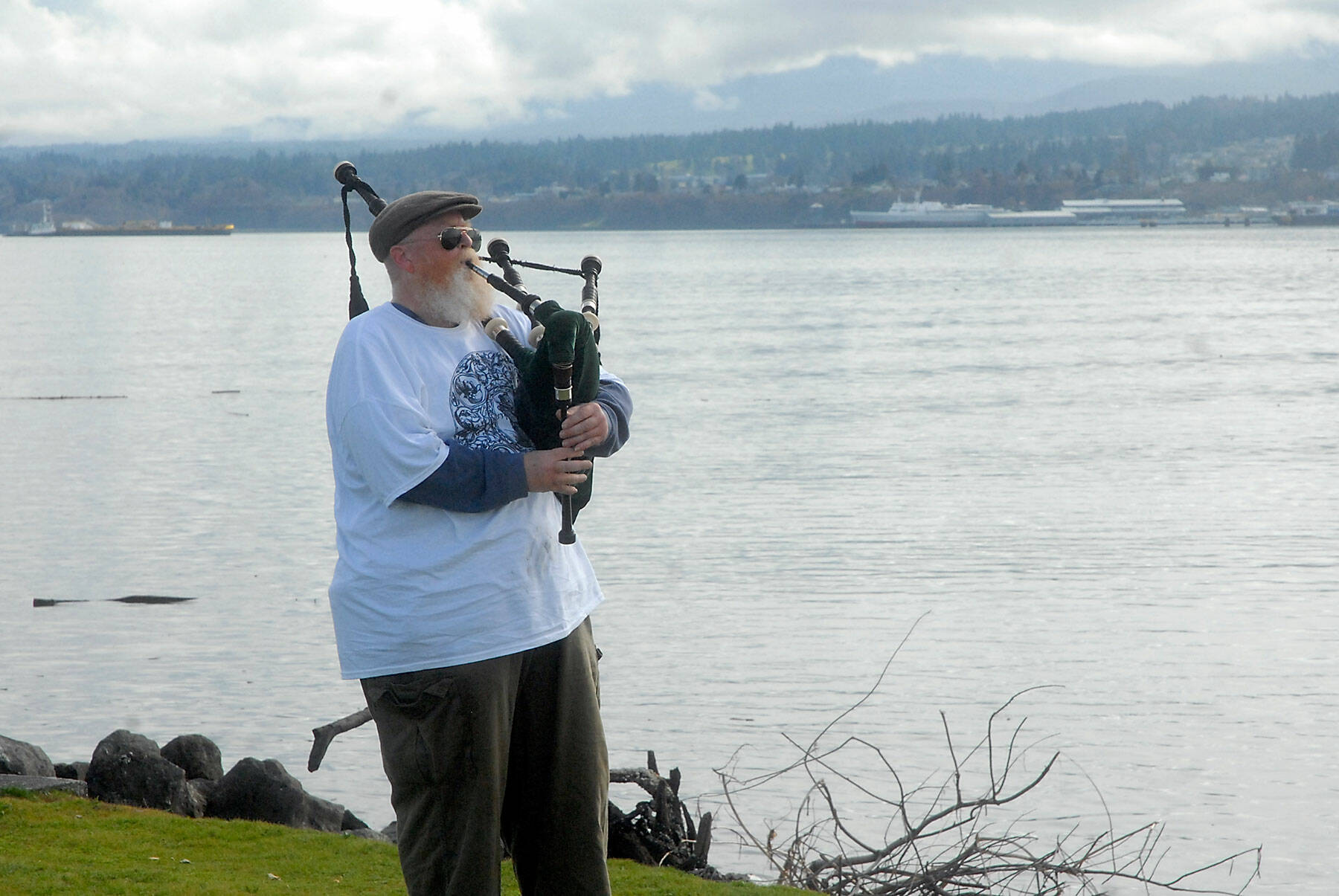 Erik Evans of Port Angeles, otherwise known as the “Parking Lot Piper,” gives a free bagpipe performance on Tuesday at Sail and Paddle Park on Ediz Hook in Port Angeles. (Keith Thorpe/Peninsula Daily News)