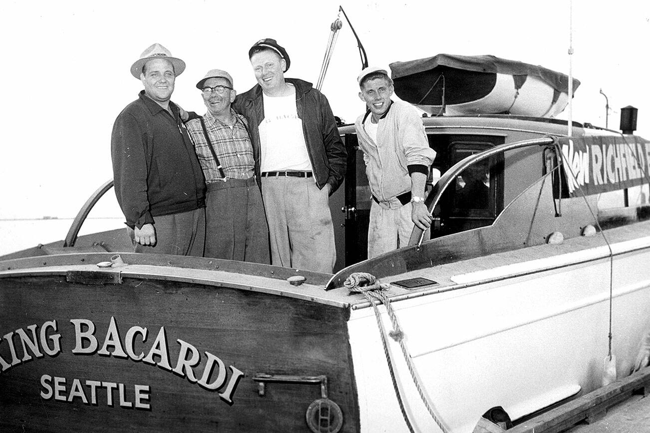 Bert Thomas and his team on the King Bacardi   Image courtesy of the North Olympic History Center

                                         Bert Thomas has on the broad-rimmed hat.   Bub Olsen has on the skippers cap.