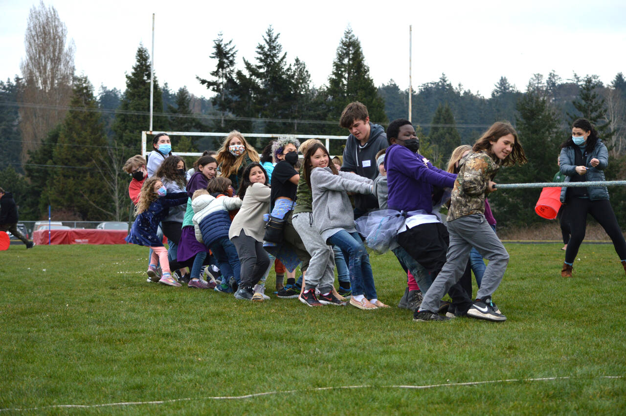 Tug of war was one of the many games youngsters played at the PT School Party, a celebration for local students, teachers and families in the Port Townsend School District. A large crowd turned out for the event at Blue Heron Middle School, where relay races, free clam chowder, cookies and DJ’d music flowed through the afternoon. Students and staff at all Olympic Peninsula Schools will have the option to wear masks indoors or not now the state mandate has been lifted. (Diane Urbani de la Paz/Peninsula Daily News)