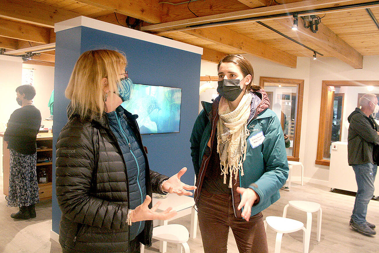 Betsy Carlson, left, and Emily Buckner discuss the Port Townsend Marine Science Center's new gift shop, which will open to the public Friday at the Flagship Landing building on Water Street. (Brian McLean/Peninsula Daily News)