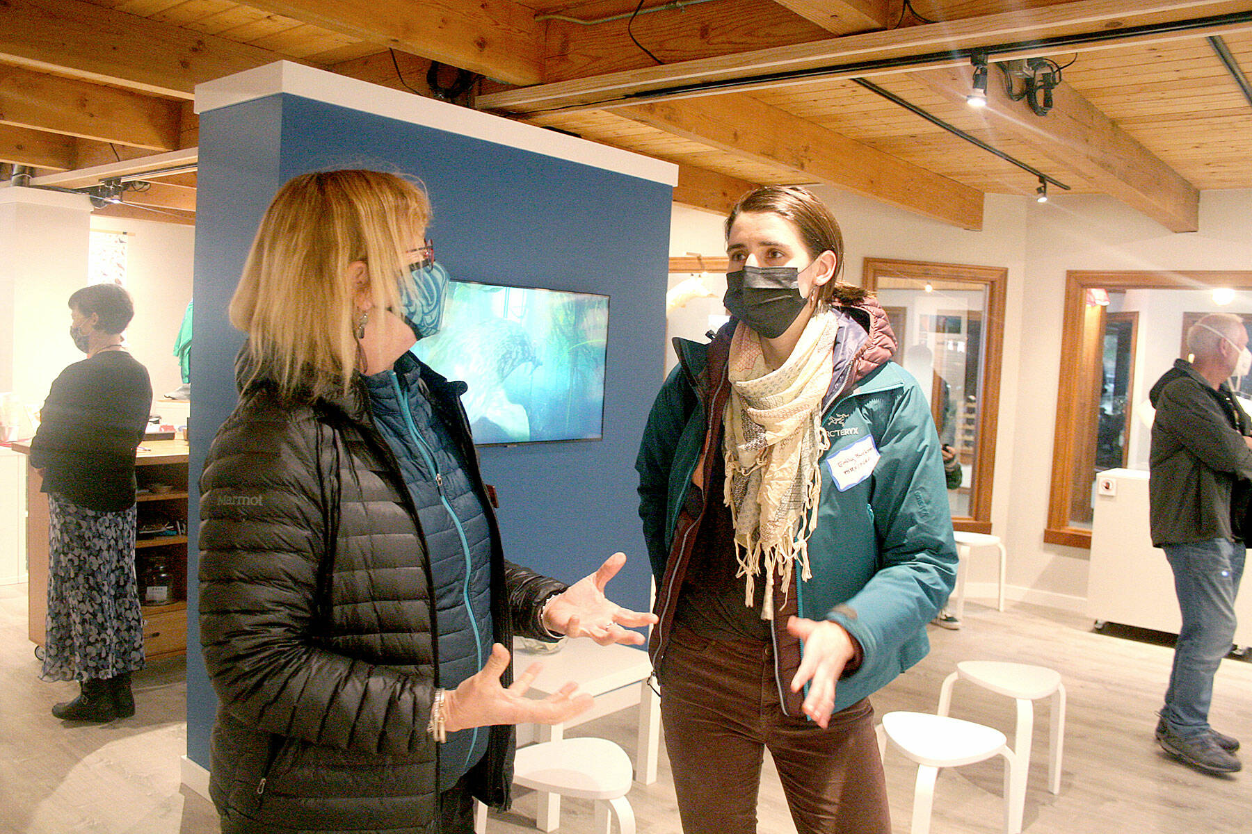Betsy Carlson, left, and Emily Buckner discuss the Port Townsend Marine Science Center’s new gift shop, which will open to the public Friday at the Flagship Landing building on Water Street. (Brian McLean/Peninsula Daily News)