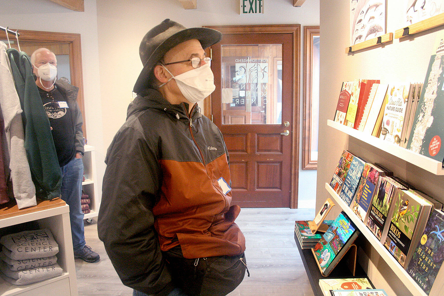 Dave Chuljiah of Port Townsend checks out a display of books available in the new Port Townsend Marine Science Center gift shop, which will open Friday at the Flagship Landing building on Water Street. (Brian McLean/Peninsula Daily News)