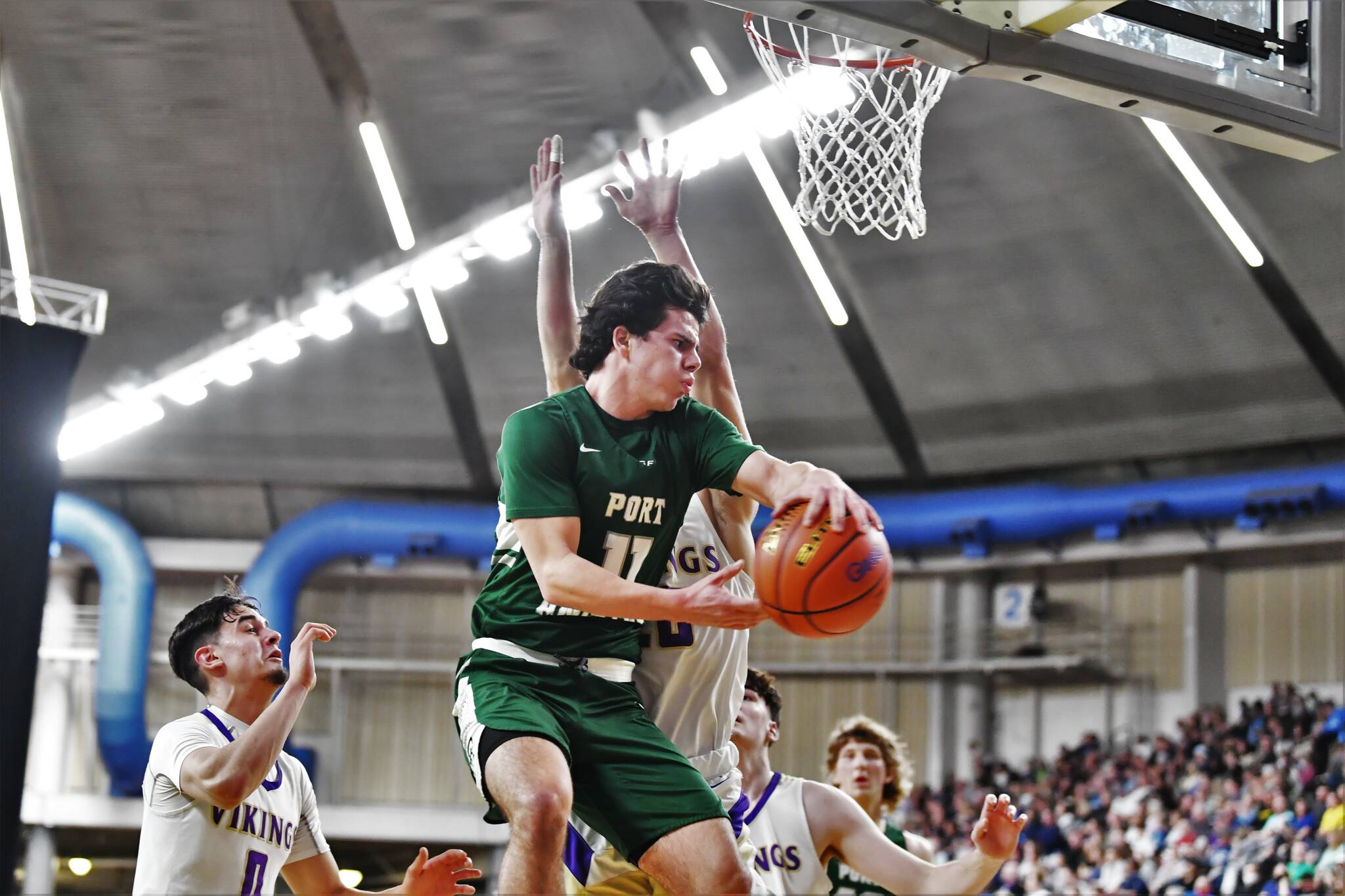Jordan Nailon/The Daily News Port Angeles’ Xander Maestas drives during the Roughriders’ 75-58 Class 2A state quarterfinal loss to North Kitsap on Thursday night at the Yakima Valley SunDome.
