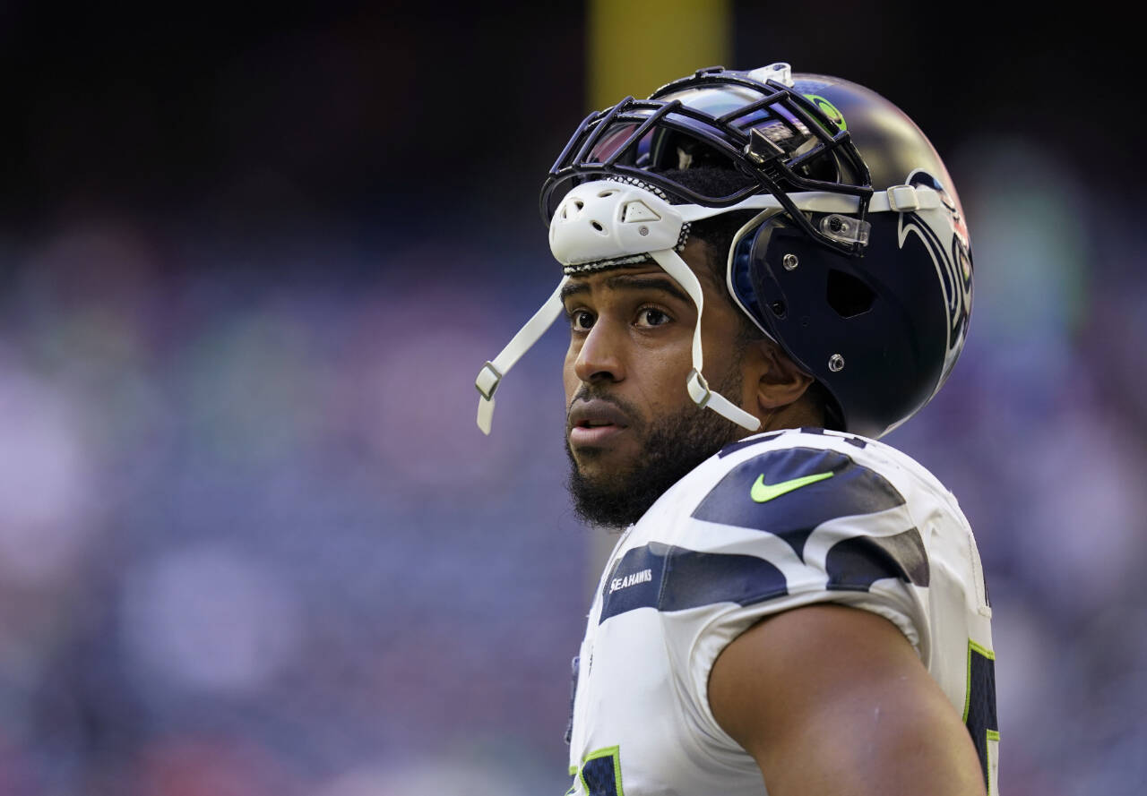 Seattle Seahawks linebacker Bobby Wagner pauses during the team’s NFL football game against the Houston Texans on Dec. 12, 2021, in Houston. Wagner confirmed that he is being released by the Seahawks on Tuesday, hours after the team agreed to trade quarterback Russell Wilson to Denver. (Matt Patterson/The Associated Press)