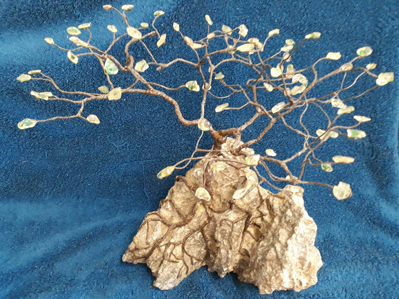 This Ming gem tree designed and made by Terry Stockman, Clallam County Gem & Mineral Association president, is one of several raffle items at the clubs annual show set for March 19-20 in Port Angeles. The gemstones are Sun Stones.