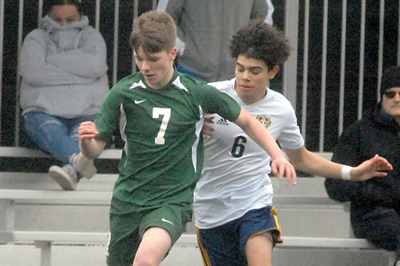 Keith Thorpe/Peninsula Daily News
Port Angeles' Caleb Gagnon, left, fends off Forks' Arturo Dominguez on Saturday in Port Angeles.