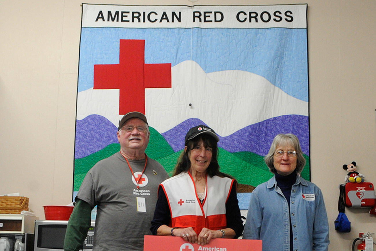 Matthew Nash/Olympic Peninsula News Group 

American Red Cross volunteers based in the Carlsborg office, from left, Don Zanon, Jean Pratschner, and Mary Ann Dangman say their volunteer numbers depleted during the COVID-19 pandemic, but they find there are many ways to reengage the volunteer group, including fire prevention, disaster preparation and connecting military families.