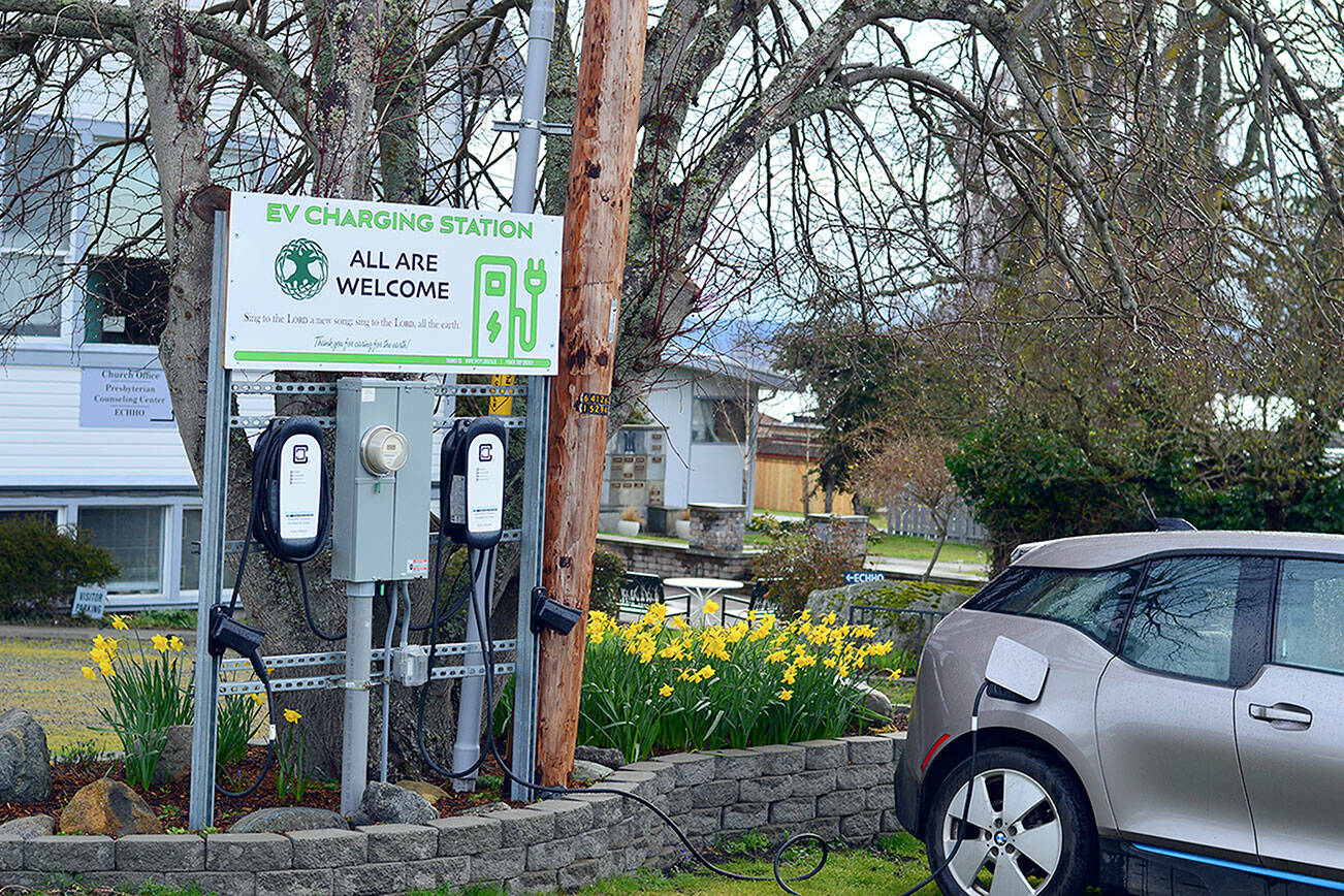 The free electric-vehicle charging station at the First Presbyterian Church, 1111 Franklin St. in Uptown Port Townsend, has been increasingly busy in the months since it was installed. One user sent a thank-you note to Holly Hallman, chairperson of the church’s Social Action, Justice and Environment committee. That driver must commute to Poulsbo, and the free juice made that feasible, she said. (Diane Urbani de la Paz/Peninsula Daily News)