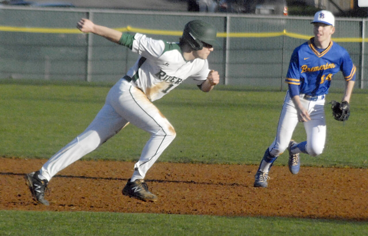 Port Angeles Beckett Jarnigan runs back to second base in a game at Civic Field on Tuesday. In on the play is Bremerton shortstop Landon Isenhart. (Keith Thorpe/Peninsula Daily News)