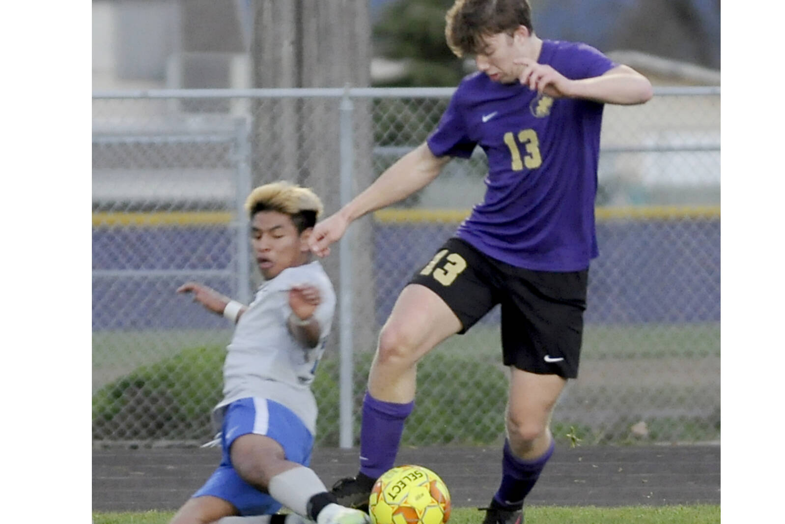 Michael Dashiell/Olympic Peninsula News Group
Sequim's Brandon Charters battles for the ball with a North Mason defender in the Wolves' 4-0 win Tuesday night in Sequim.