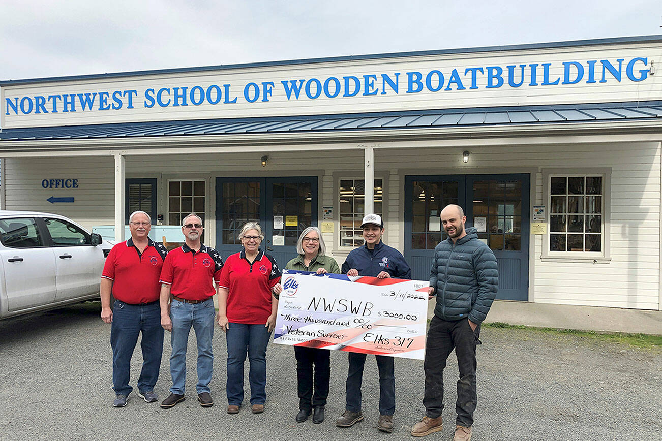 (Boat School donation)   In support of veterans at the Northwest School of Wooden Boatbuilding in Port Hadlock, the Port Townsend Elks Lodge presented the school with a $3,000 donation earlier this month. From left are Elks board chair Jerry Lucas, Elks officers Jim Aman and Shirlee Beck, Elks veteran chair Rita Frangione, VetCorps peer specialist Antonio Romero and boatbuilding instructor Tucker Piontek. Romero, himself a veteran, works with fellow veteran students to make their Boat School experience a rewarding one. For information about the school and its Veterans Supportive Campus program, contact Romero at  antonio.romero@nwswb.edu.