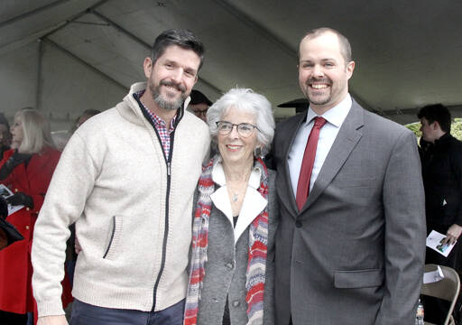 From left, Chris Cahall, Betsy Reed Schultz and Jody Pinkelman were among about 200 in attendance Sunday for the dedication of the Captain Joseph House. A large tent covered the ceremony on south Oak Street, and Cahall and Pinkelman, both retired from the U.S. Special Forces, shared their experiences as they served with Captain Joseph Schultz, who was killed in Afghanistan in 2011. The house will serve as a place of rest for Gold Star families. (Dave Logan/for Peninsula Daily News)