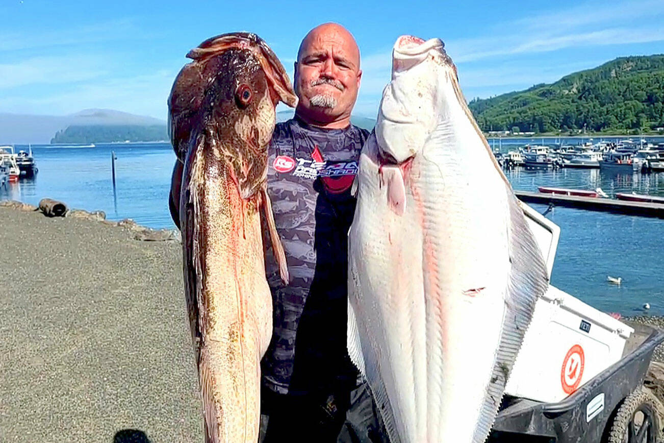 Olympic Chapter of Salmon for Soliders member Daniel Goettling caught this halibut and lingcod while fishing with a group of military veterans last summer. Halibut fishing begins April 7 in Marine Areas 6-10.